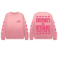 Pink sweatshirt with 'Everyone's a Star! World Tour 26' text and star designs on a white background